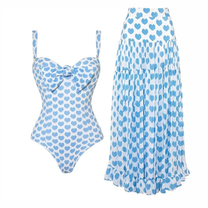 Blue heart bikini top, bottom and sarong laid flat for women swimwear collection
